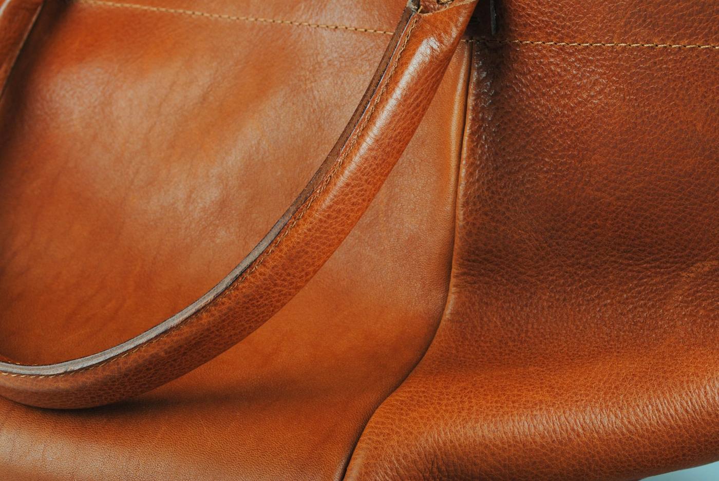 Brown leather handbag with a long strap